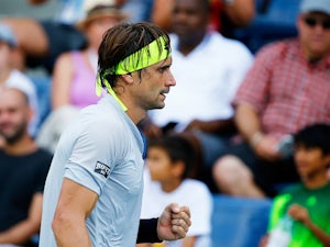 Ferrer ousts Isner to set up Murray clash