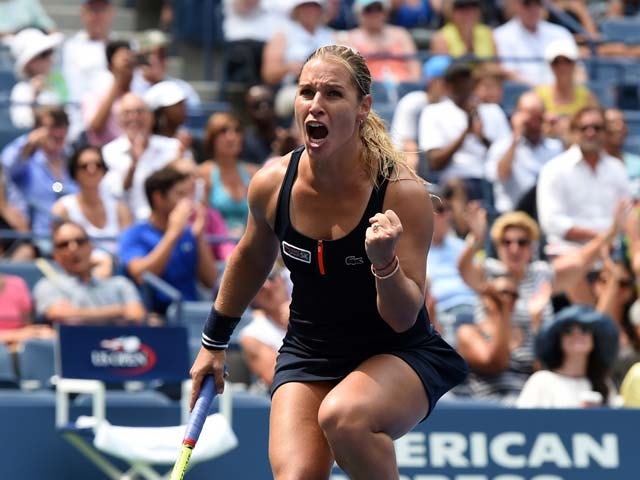 Dominika Cibulkova of Slovakia celebrates match point against Ana Ivanovic of Serbia during their Women's singles 2015 US Open round 1 match at the USTA Billie Jean King National Tennis Center August 31, 2015