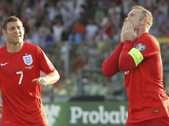 Wayne Rooney of England celebrates after scoring the opening goal during the UEFA EURO 2016 Qualifier between San Marino and England at Stadio Olimpico on September 5, 2015