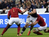 Scotland's lock Jonny Gray (C) vies for the ball with France's prop Eddy Ben Arous (L) during the rugby union test match between France and Scotland at the Stade de France in Saint-Denis, north of Paris