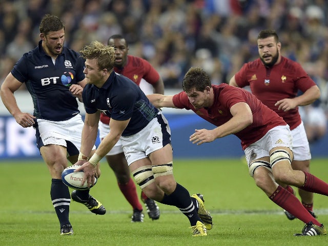 France's lock Alexandre Flanquart (R) tackles Scotland's number 8 David Denton (L) during the rugby union test match between France and Scotland at the Stade de France in Saint-Denis, north of Paris, on August 5, 2015.