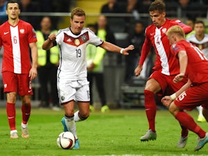 Poland´s Grzegorz Krychowiak and Germany's midfielder Mario Gotze vie for the ball during the Euro 2016 qualifying football match between Germany and Poland in Frankfurt am Main, central Germany, on September 4, 2015. Germany wins 3-1.