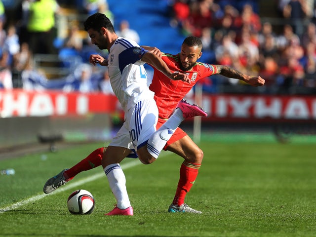 Wales's defender Ashley Richards (R) vies with Israel's defender Omri Ben Harush during the Euro 2016 qualifying group B football match between Wales and Israel at Cardiff City Stadium in Cardiff, south Wales, on September 6, 2015