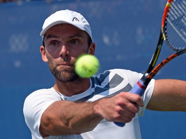 Ivo Karlovic of Croatia hits a return to Federico Delbonis of Argentia during their US Open 2015 first round men's singles match at the USTA Billie Jean King National Center September 1, 2015