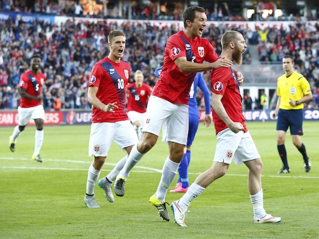 Norway's Jo Inge Berget (R) celebrates scoring 1 - 0 with his teammates Markus Henriksen (L) and Even Hovland during the Euro 2016 Group H qualifying football match between Norway and Croatia at in Oslo, on September 6, 2015.