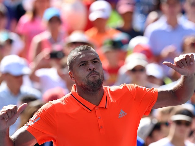 Jo-Wilfried Tsonga of France celebrates after defeating his compatriot Benoit Paire during their 2015 US Open Men's singles round 4 match at USTA Billie Jean King National Tennis Center in New York on September 6, 2015. Tsonga won 6-4, 6-3, 6-4.