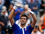 Novak Djokovic of Serbia celebrates after defeating Joao Souza of Brazil in their Men's Singles First Round match on Day One of the 2015 US Open at the USTA Billie Jean King National Tennis Center on August 31, 2015