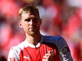 Per Mertesacker of Arsenal celebrates his team's 1-0 win in the FA Community Shield match between Chelsea and Arsenal at Wembley Stadium on August 2, 2015