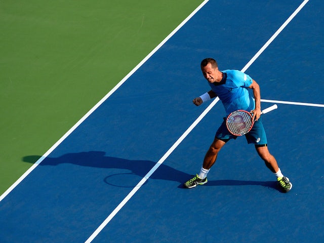 Philipp Kohlschreiber of Germany celebrates after defeating Alexander Zverev of Germany during their Men's Singles First Round match on Day Two of the 2015 US Open at the USTA Billie Jean King National Tennis Center on September 1, 2015 in the Flushing ne