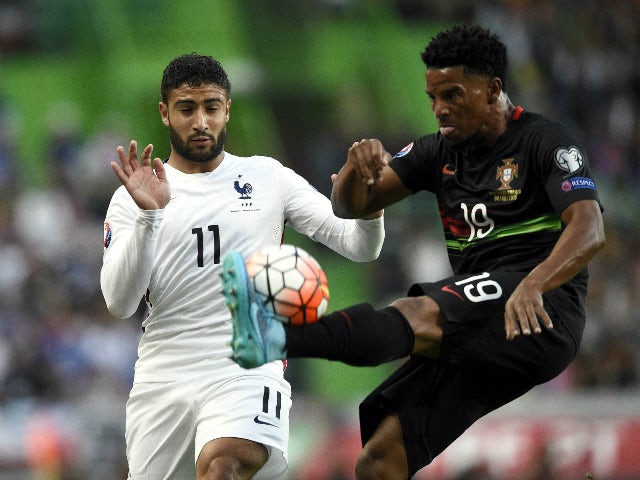 France's forward Nabil Fekir (L) vies with Portugal's defender Eliseu during the Euro 2016 friendly football match Portugal vs France at the Jose Alvalade stadium in Lisbon on September 4, 2015.