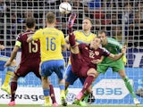 Russia's forward Artem Dzyuba (C) attacks Sweden's net during their UEFA Euro 2016 qualifying round Group G football match between Russia and Sweden at Otkrytie Arena in Moscow on September 5, 201