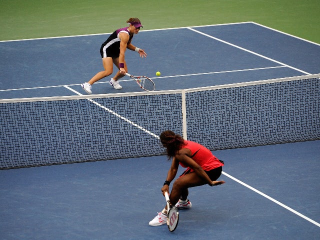 Samantha Stosur of Australia returns a shot against Serena Williams of the United States during the Women's Singles Final on Day Fourteen of the 2011 US Open at the USTA Billie Jean King National Tennis Center on September 11, 2011 in the Flushing neighbo