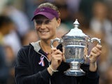 Samantha Stosur of Australia celebrates with the championship trophy after defeating Serena Williams of the United States to win the Women's Singles Final on Day Fourteen of the 2011 US Open at the USTA Billie Jean King National Tennis Center on September
