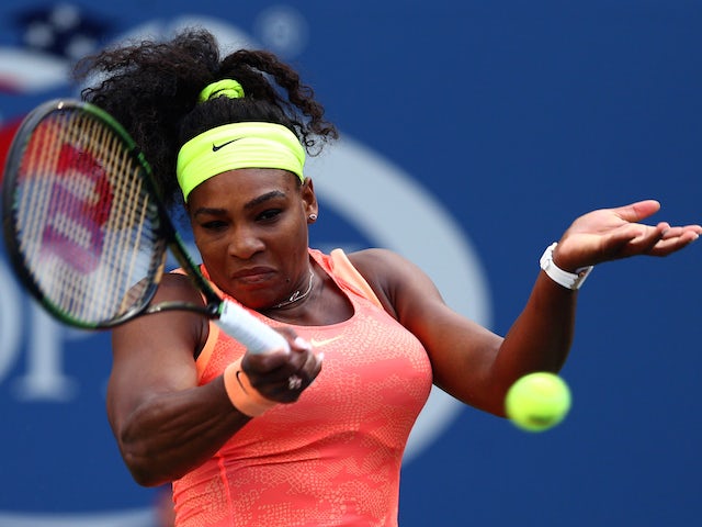 Serena Williams of the United States returns a shot to Madison Keys of the United States during their Women's Singles Fourth Round match on Day Seven of the 2015 US Open