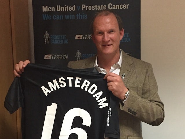 Simon Grayson poses with a Men United shirt to promote the Football to Amsterdam bike ride