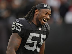 Linebacker Sio Moore #55 of the Oakland Raiders smiles after defeating the San Francisco 49ers on December 7, 2014