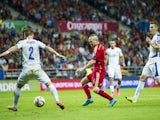 Andres Iniesta of Spain duels for the ball with Peter Pekarik of Slovakia during the Spain v Slovakia EURO 2016 Qualifier at Carlos Tartiere on September 5, 2015 in Oviedo, Spain.
