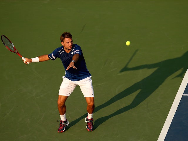 Stan Wawrinka of Switzerland returns a shot against Albert Ramos-Vinolas of Spain during their Men's Singles First Round match on Day Two of the 2015 US Open at the USTA Billie Jean King National Tennis Center on September 1, 2015 in the Flushing neighbor