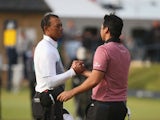 Tiger Woods of the United States and Jason Day of Australia shake hands on the 18th green during the second round of the 144th Open Championship at The Old Course on July 18, 2015