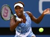 Venus Williams of the United States returns a shot against Anett Kontaveit of Estonia during their Women's Singles Fourth Round match on Day Seven of the 2015 US Open