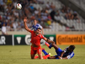 Wales player Hal Robson-Kanu is challenged by Dossa Junior of Cyprus during the UEFA EURO 2016 Qualifier between Cyprus and Wales at GPS Stadium on September 3, 2015