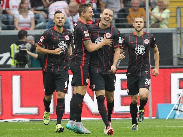 Alexander Meier celebrates with teammates after scoring for Eintracht Frankfurt against Koln on September 12, 2015