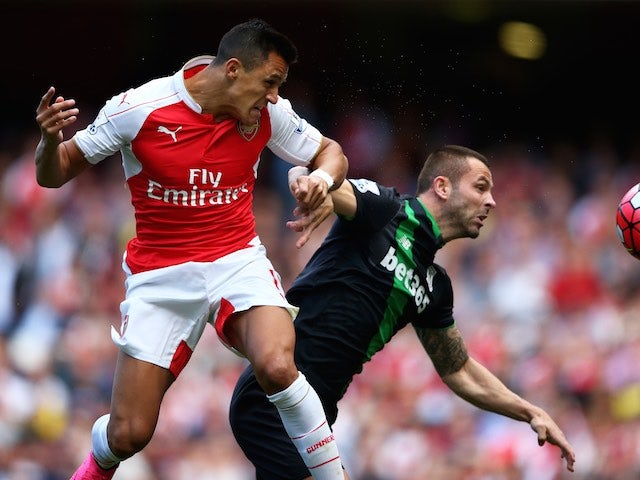 Alexis Sanchez and Phil Bardsley tussle during the game between Arsenal and Stoke on September 12, 2015