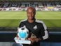 Andrew Ayew of Swansea City holds his Player of the Month award for August 2015