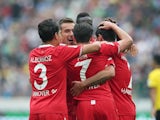 Artur Sobiech is congratulated by Hannover teammates after he scores the opener against Dortmund on September 12, 2015