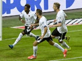 Austria's David Alaba (L) celebrates scoring a penalty with his team-mates Martin Harnik (C) and Marc Janko (R) during the Euro 2016 qualifying group G football match between Sweden and Austria at the Friends Arena in Solna, near Stockholm on September 8,
