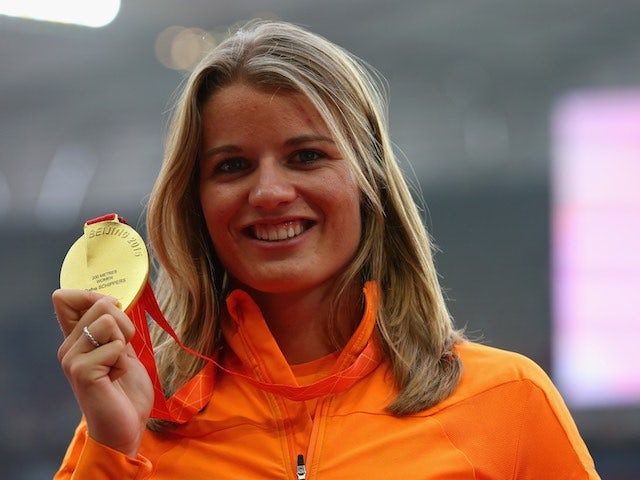 The Netherlands' Dafne Schippers poses with her gold medal in her right hand after winning the 200m at the World Championships on August 29, 2015