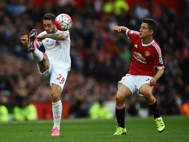 Liverpool's Danny Ings and Man Utd's Ander Herrera in action on September 12, 2015