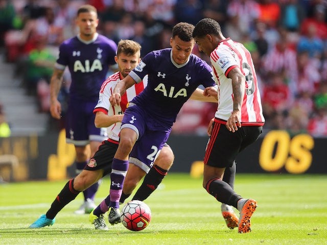Del Alli is tagteamed by Fabio Borini and Patrick van Aanholt during the game between Sunderland and Spurs on September 13, 2015