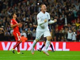 Wayne Rooney of England celebrates scoring their second goal from the penalty spot during the UEFA EURO 2016 Group E qualifying match between England and Switzerland at Wembley Stadium on September 8, 2015