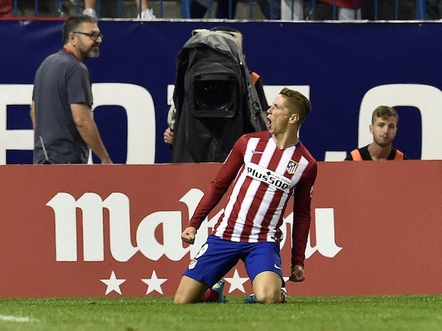 Fernando Torres drops to his knees after scoring for Atletico Madrid against Barcelona on September 12, 2015