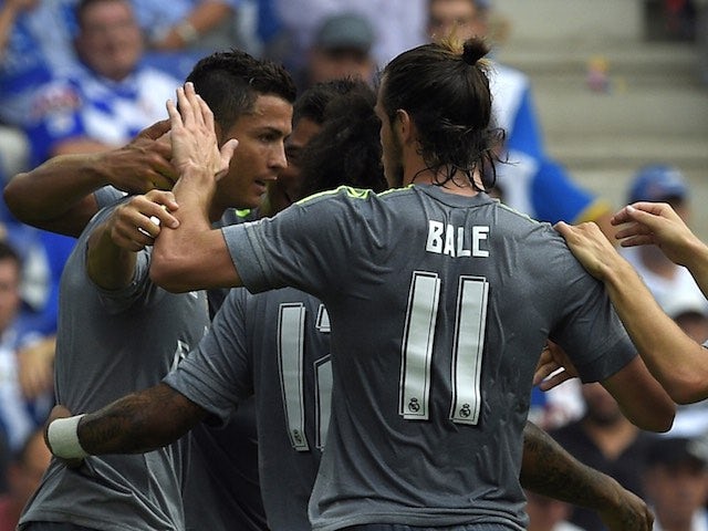 Gareth Bale congratulates Cristiano Ronaldo during the game between Real Madrid and Espanyol on September 12, 2015