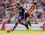 Harry Kane and Billy Jones in action during the game between Spurs and Sunderland on September 13, 2015