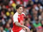 Hector Bellerin of Arsenal runs with the ball during the Emirates Cup match between Arsenal and VfL Wolfsburg at the Emirates Stadium on July 26, 2015