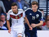 Jonas Hector of Germany is closed down by James Forrest of Scotland during the UEFA EURO 2016 Qualifier Group D match between Scotland and Germany at Hampden Park on September 7, 2015 in Glasgow, Scotland.