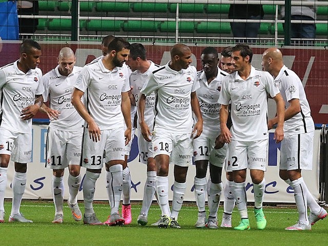 Caen players celebrate after Julien Feret grabs the opener against Troyes on September 12, 2015