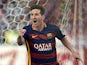 Lionel Messi celebrates scoring to put Barcelona 2-1 up over Atletico Madrid on September 12, 2015