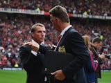 Louis van Gaal and Brendan Rodgers exchange a weird handshake prior to the game between Manchester United and Liverpool on September 12, 2015