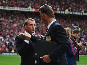 Louis van Gaal and Brendan Rodgers exchange a weird handshake prior to the game between Manchester United and Liverpool on September 12, 2015