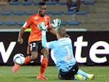 Angers keeper Ludovic Butelle attempts to distract Lorient's Benjamin Moukandjo with jazz hands on September 12, 2015