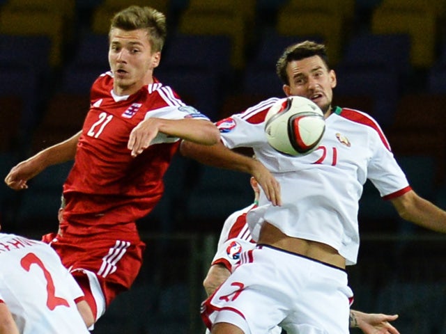 Luxembourg's forward Maurice Deville (L) jumps for the ball with Belarus' defender Yegor Filipenko during the Euro 2016 qualifying football match between Belarus and Luxembourg in Borisov, outside Minsk, on September 8, 2015