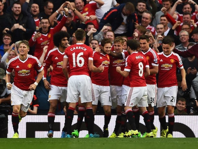 Man Utd players celebrate after Daley Blind gets the breakthrough against Liverpool on September 12, 2015