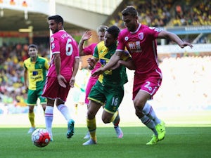 Norwich's Matt Jarvis is challenged by Simon Francis of Bournemouth on September 12, 2015