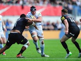 Mitch Lees of Exeter Chiefs is tackled by Mako Vunipola of Saracens during the Aviva Premiership match between Saracens and Exeter Chiefs at Allianz Park on May 10, 2015 in Barnet, England.