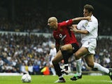 Rio Ferdinand of Manchester United battles for the ball with Mark Viduka of Leeds during the FA Barclaycard Premiership game between Leeds United and Manchester United at Elland Road in Leeds, England on September14 , 2002. 