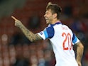Russia's Fedor Smolov celebrates after scoring his team's fifth goal during the Euro 2016 qualifying football match between Liechtenstein and Russia at the Rheintal stadium in Vaduz on September 8, 2015
